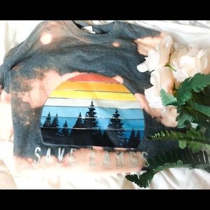 One of a kind save lands tee